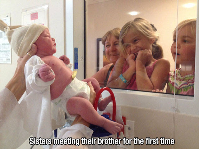 Sisters meeting their brother for the first time