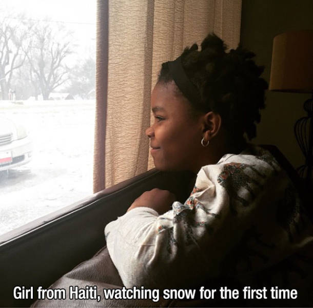 Girl from haiti, watching snow for the first time
